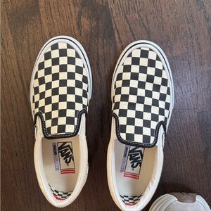 Vans Black and White Checkerboard Slip-On Sneakers